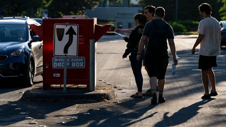 From left, Vancouver residents Alyssa Wheeler, Jonathan Wheeler, Tabor Kelly...