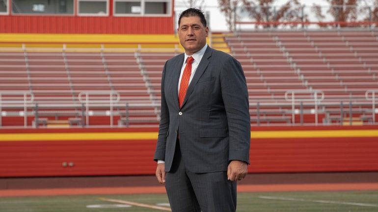 New football coach Thomas Claro stands on Chaminade's field at...