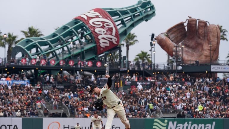 San Francisco Giants' Blake Snell pitches to a Colorado Rockies...