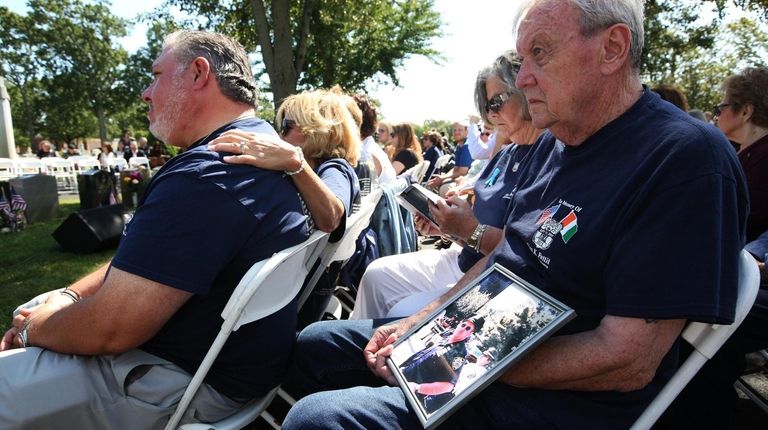 At the Mass in Westbury, John Heslin, of Carle Place,...