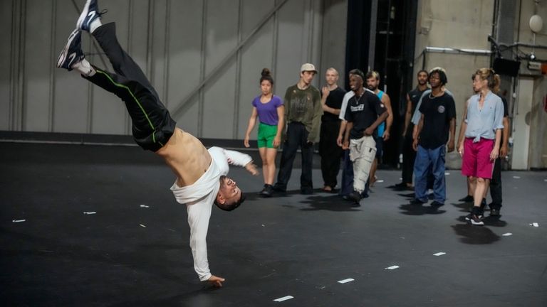 Dancers rehearse for "Dance of the Games" at the concert...