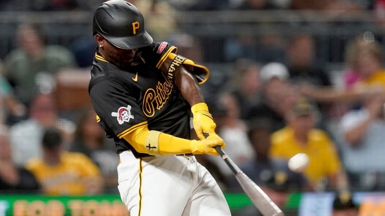 Pittsburgh Pirates' Andrew McCutchen hits a three-run home run during...