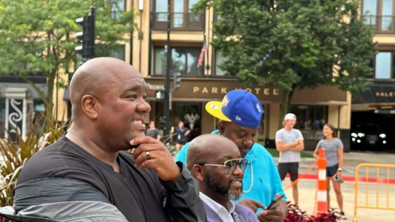 Dane County Boys and Girls Club President Michael Johnson, left,...