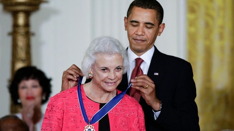 President Barack Obama presents the 2009 Presidential Medal of Freedom...