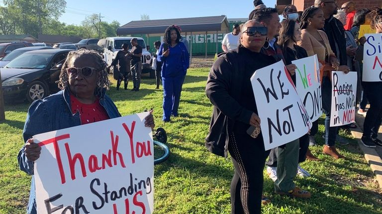 Glenda Austin of Idabel, Okla., holds a sign with other...