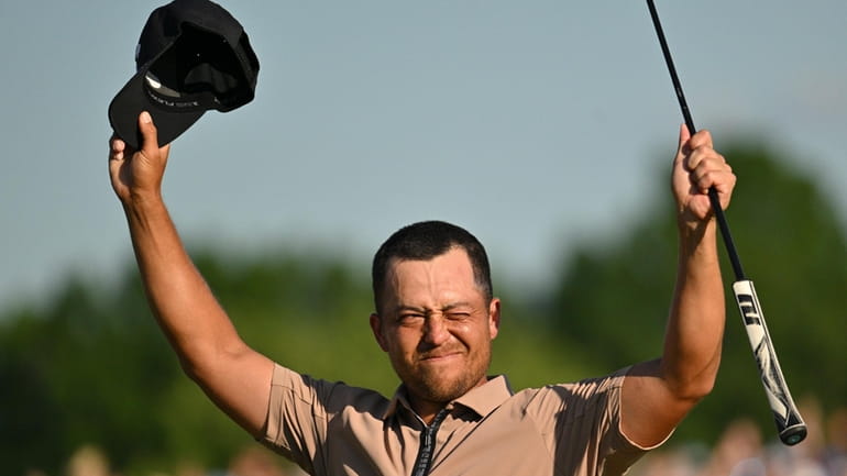 Xander Schauffele celebrates after winning the PGA Championship golf tournament...