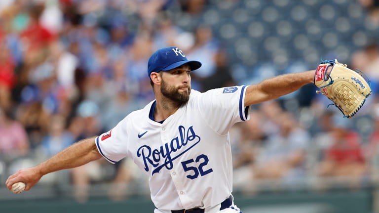 Kansas City Royals pitcher Michael Wacha delivers to a Cleveland...