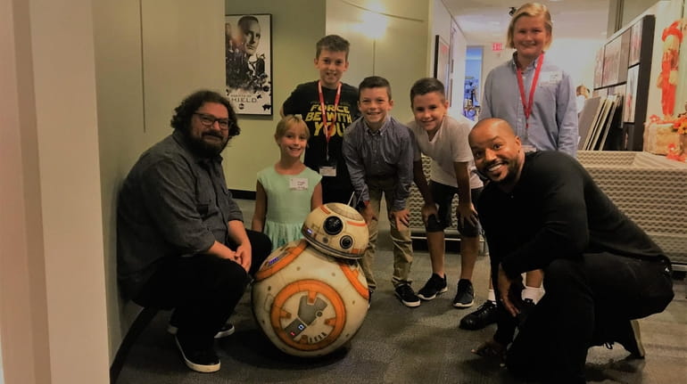 Actors Bobby Moynihan and Donald Faison and BB-8 the droid,...