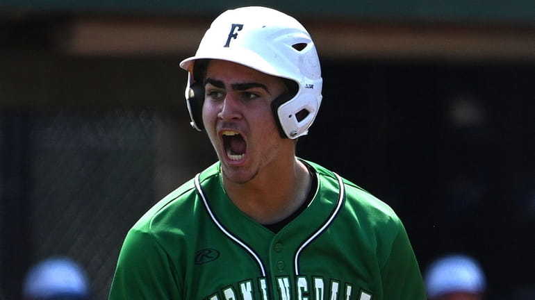 Joe Tagliavia #31 of Farmingdale reacts after crossing home plate...