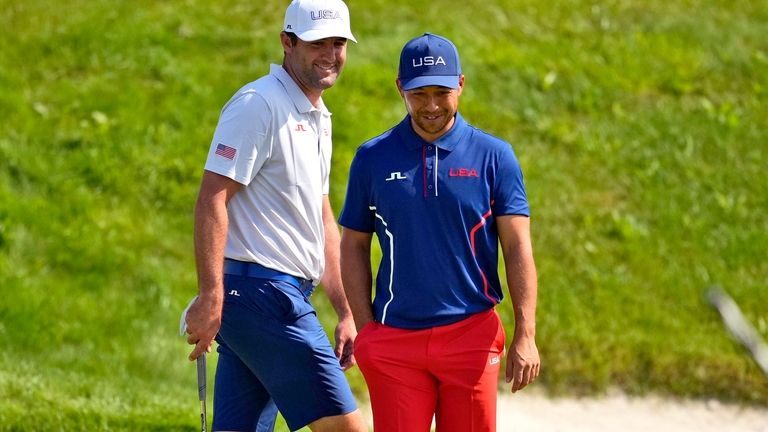 Scottie Scheffler, left, and Xander Schauffele, of the United States,...