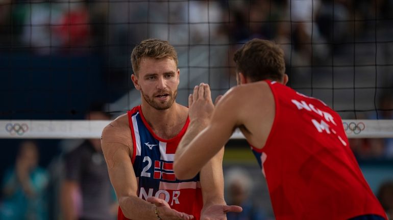 Norway's Christian Sandlie Soerum, left, and Anders Berntsen Mol react...