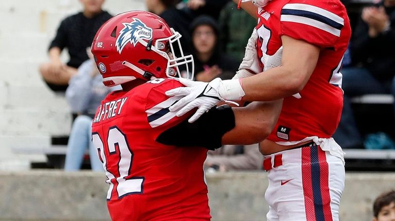 Damien Caffrey Ross Tallarico of the Stony Brook Seawolves celebrates...