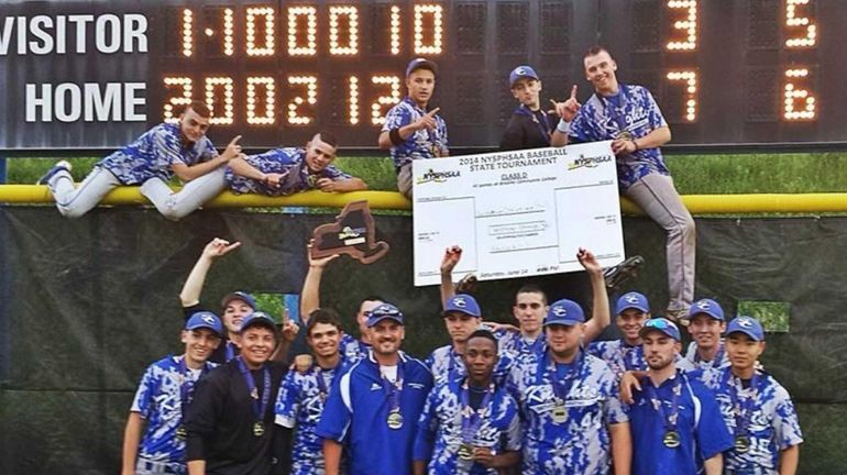 The Smithtown Christian baseball team celebrates its state Class D...