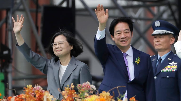 Taiwan's new President Lai Ching-te, right, and former President Tsai...