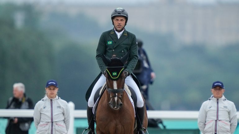 Brazil's Carlos Parros and his horse Safira during the Equestrian...