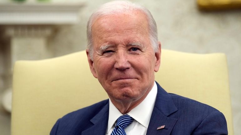 President Joe Biden listens as he meets with Denmark's Prime...