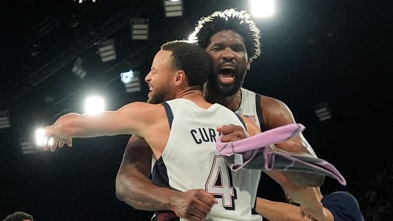 United States' Stephen Curry (4) and United States' Joel Embiid...