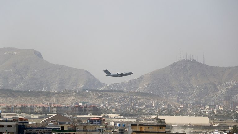 U.S military aircraft takes off at the Hamid Karzai International...