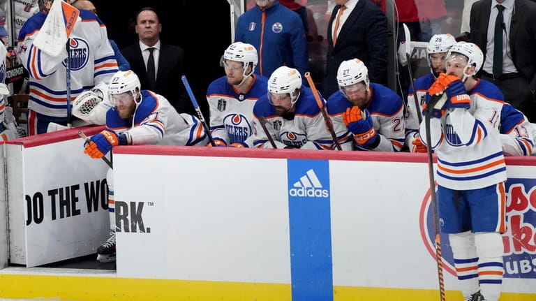 The Edmonton Oilers react after losing Game 7 of the...