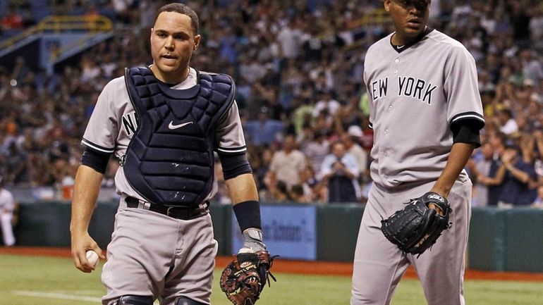 New York Yankees catcher Russell Martin, left, and starting pitcher...