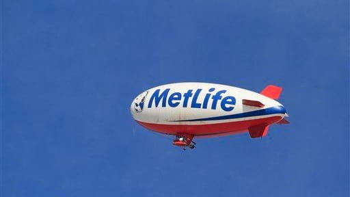 The MetLife blimp flies high over the golf course during...