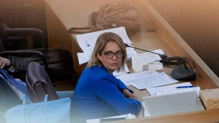 Prosecuting Magistrate Carmen Ruggiero sits in the in bunker hall...