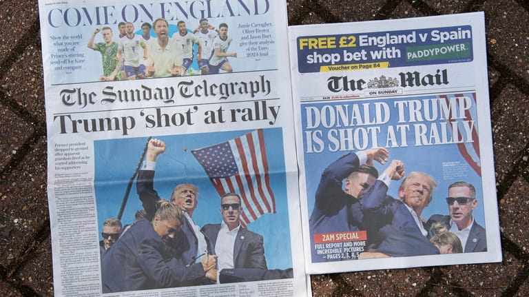 Two front pages of British national newspapers, late editions for...