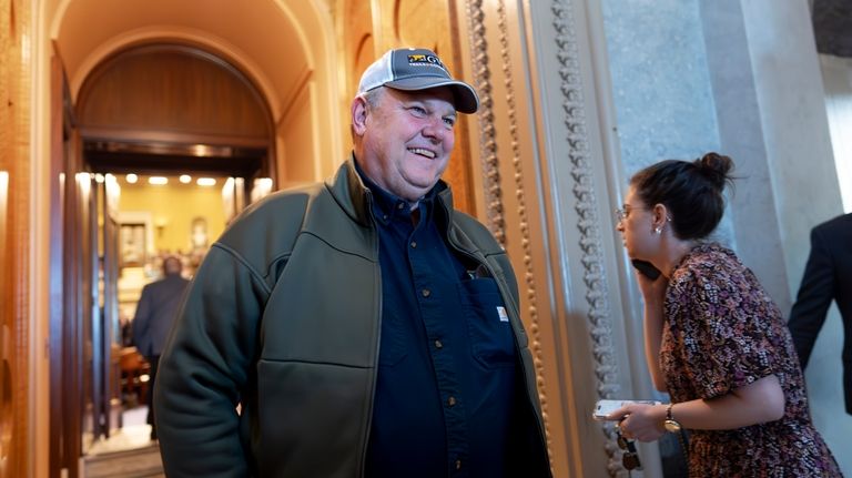 Sen. Jon Tester, D-Mont., leaves the chamber as the Senate...