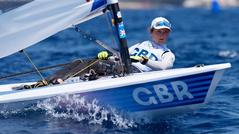 Hannah Snellgrove of Britain sails upwind during an ILCA 6...