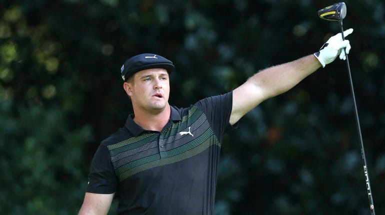 Bryson DeChambeau reacts to his tee shot on the 11th...