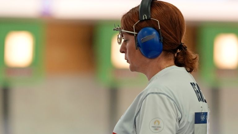 Georgia's Nino Salukvadze gestures during the 10m air pistol women's...