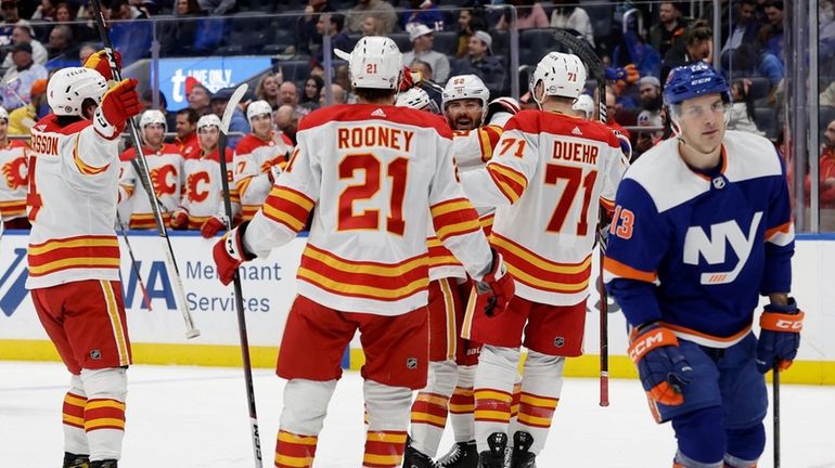 MacKenzie Weegar of the Calgary Flames celebrates his second-period goal against...