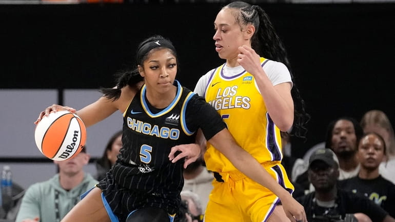 Chicago Sky's Angel Reese (5) drives to the basket as...