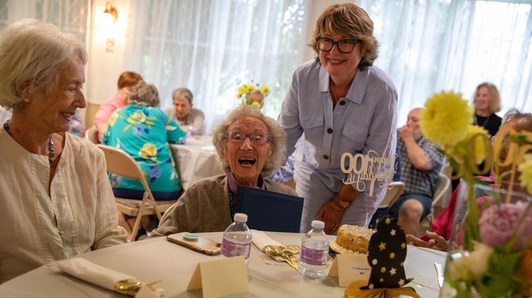 Vera Lazarich, left, of East Hampton, is awarded a proclamation from...