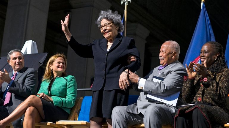 Joyce Dinkins acknowledges applause during a ceremony in October 2015 in which...