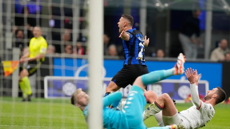 Inter Milan's Kristjan Asllani, center rear, celebrates after scoring against...
