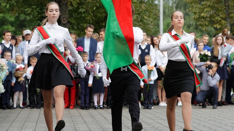 Schoolchildren march during the traditional opening of the school year,...