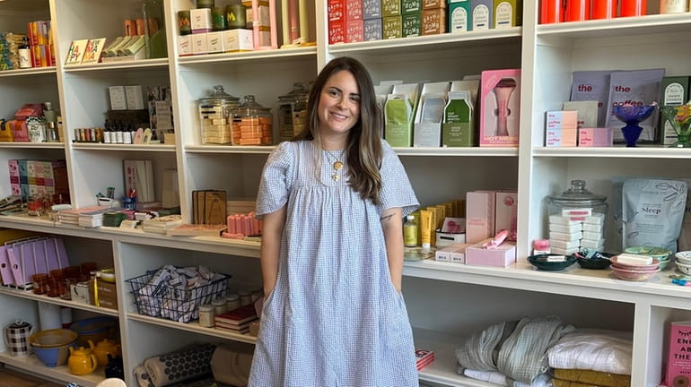 Ashley Kost at Village, her shop in Sayville for women...