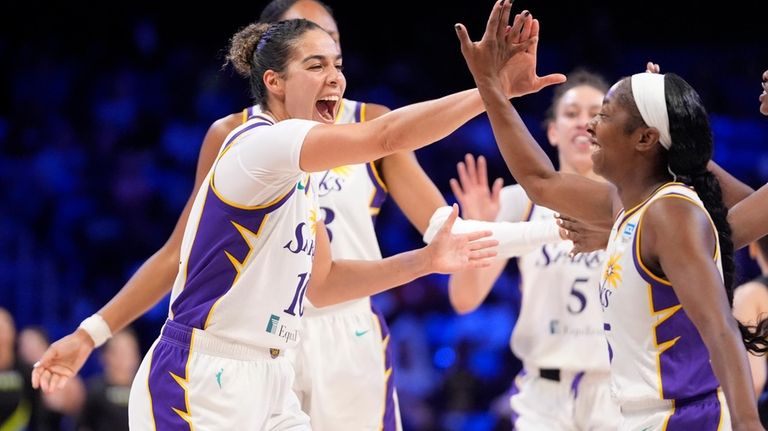 Los Angeles Sparks' Kia Nurse, left, and Aari McDonald, right,...