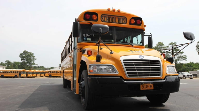 An example of a new low-emission school bus provided to...