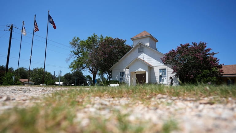 A woman visits the First Baptist Church in Sutherland Springs,...