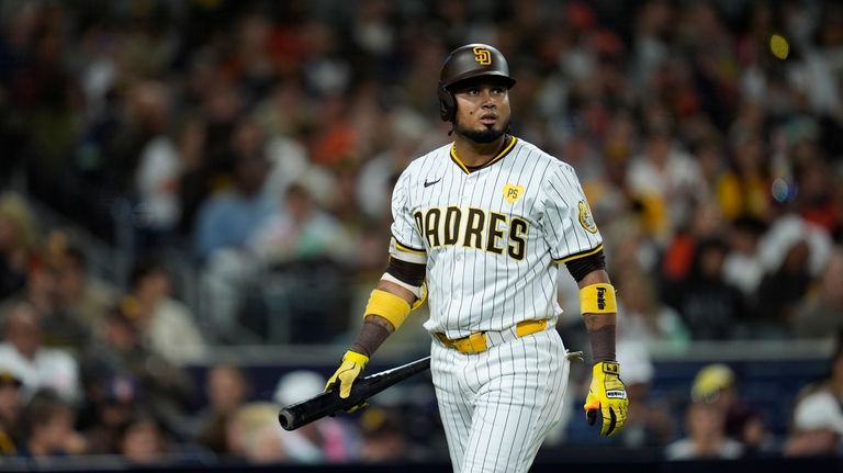 San Diego Padres' Luis Arraez walks towards the dugout after...