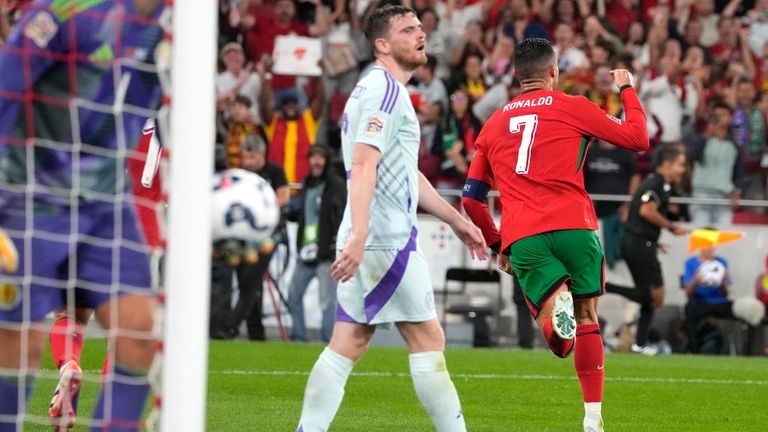 Portugal's Cristiano Ronaldo, right, celebrates after scoring his side's second...