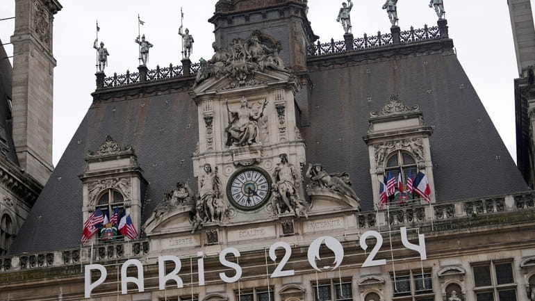 The logo of the Paris 2024 Olympic Games hangs from...