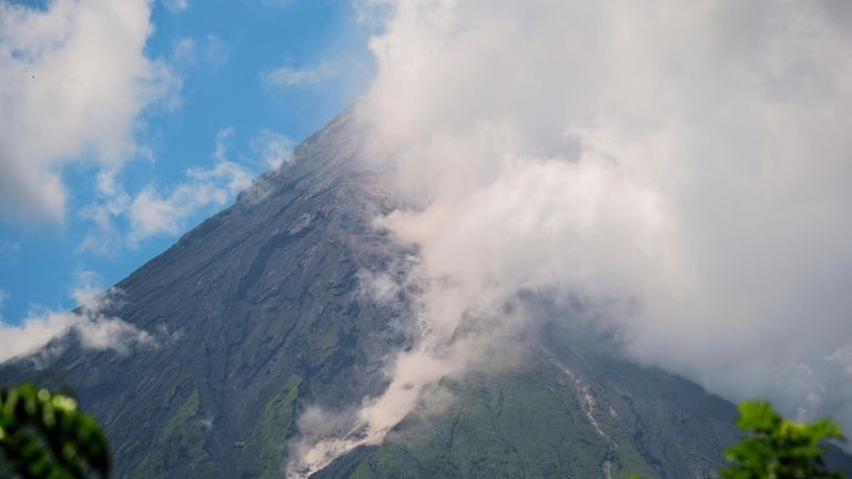 Mayon Volcano spews white smoke as seen from Daraga, Albay...