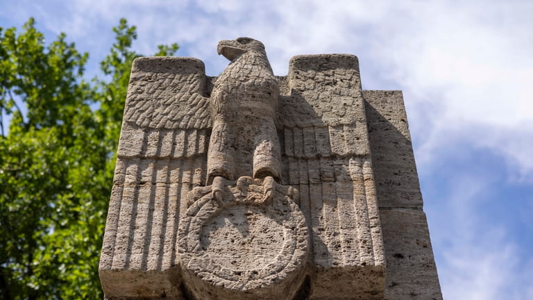 A Nazi eagle with its swastika removed on a pillar...