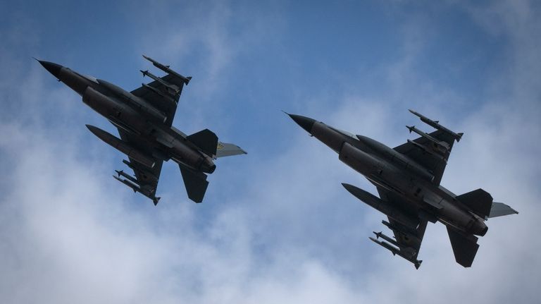 The Ukrainian Air Force's F-16 fighter jets fly in an...