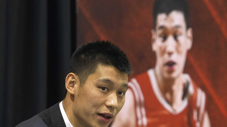 Jeremy Lin of the Houston Rockets speaks to the media...
