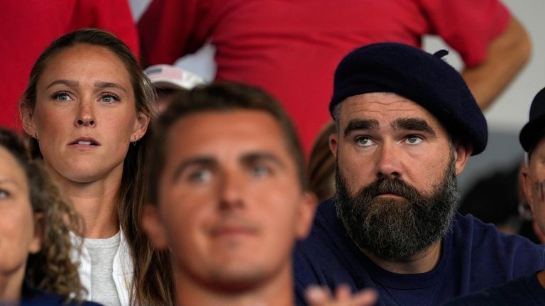 Recently retired Philadelphia Eagles lineman Jason Kelce, right, and wife...