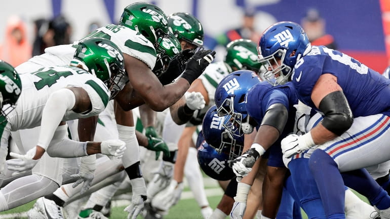 The Giants line up against the Jets at MetLife Stadium on...